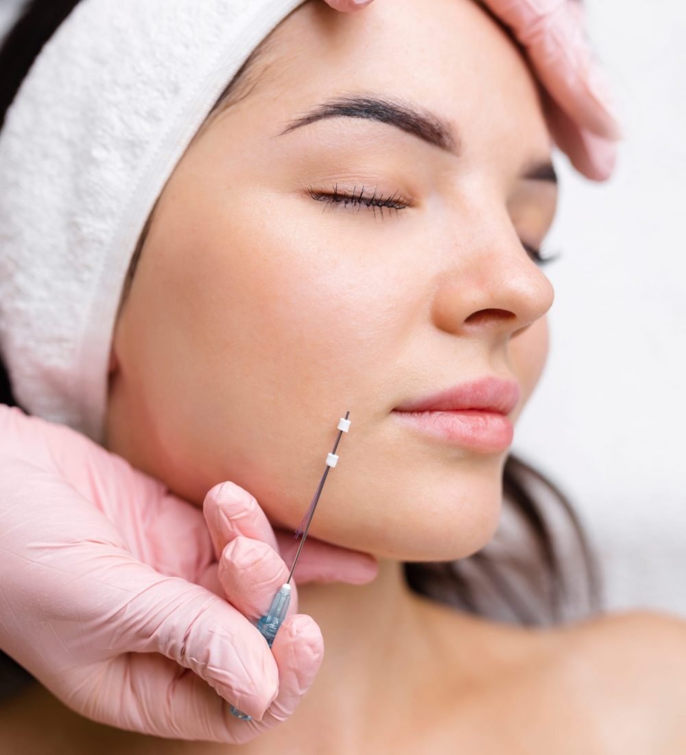 Face lifting PDO Suture operation. innovative technique of New thread lift, cosmetologist preparing to do procedure to female client, select the appropriate thread option.